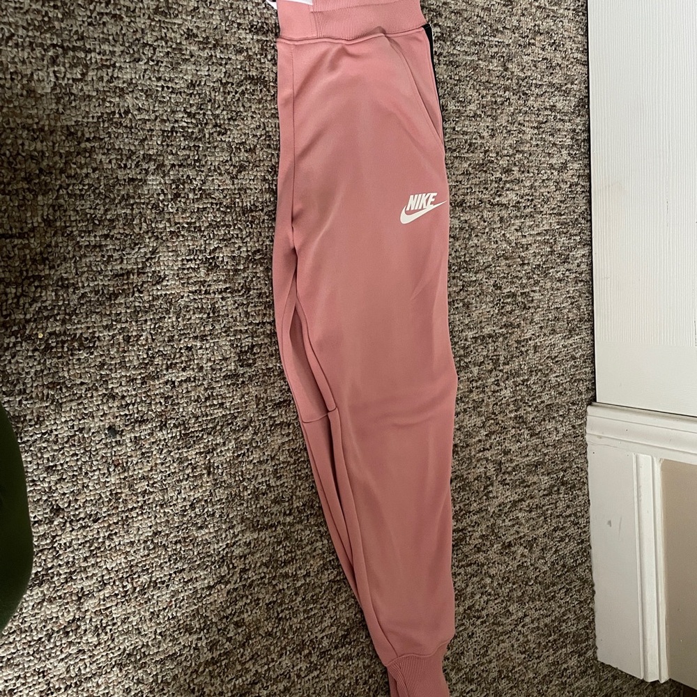 Mauve colored Nike tracksuit. Womens.Size Medium
